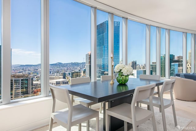 201 Folsom St Unit 38E, San Francisco, CA 94105 - dining space with a view of city, a mountain view, and expansive windows