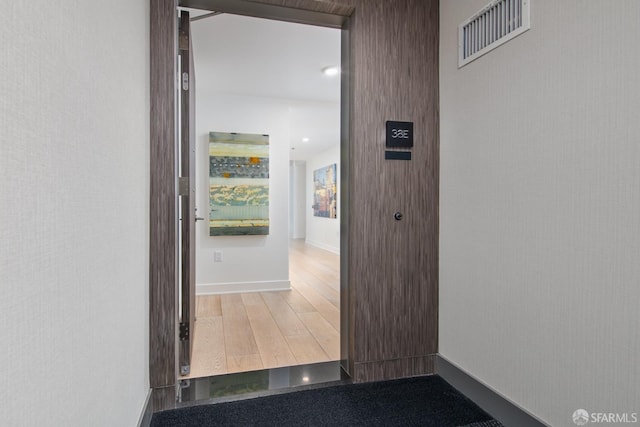 201 Folsom St Unit 38E, San Francisco, CA 94105 - hallway featuring wood finished floors and baseboards