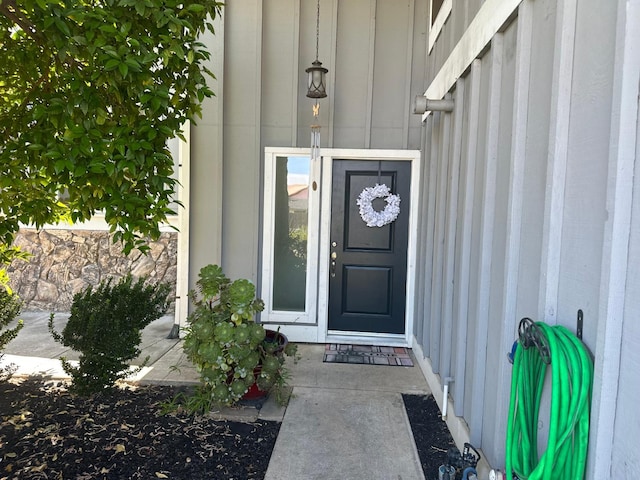 6517 Filaree Way, Sacramento, CA 95842 - view of exterior entry featuring board and batten siding