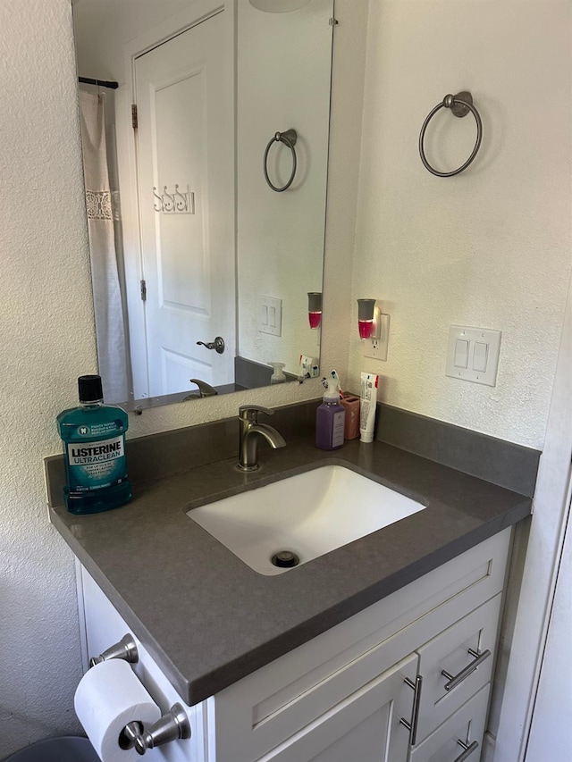 6517 Filaree Way, Sacramento, CA 95842 - bathroom with a textured wall and vanity
