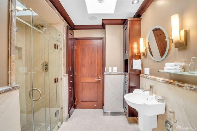 bathroom with a skylight and walk in shower