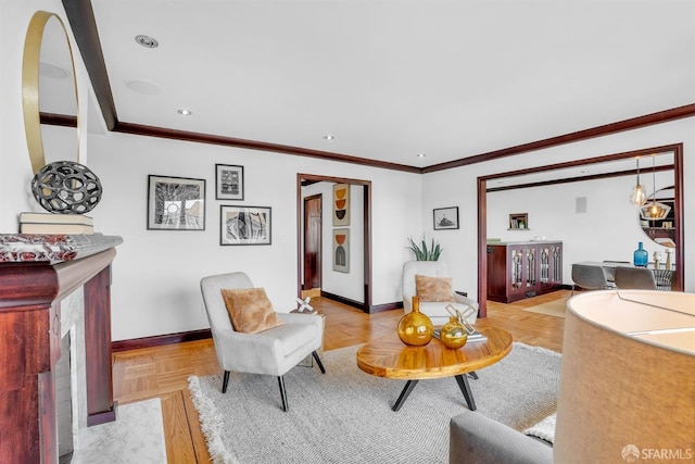 living room with ornamental molding and light parquet flooring