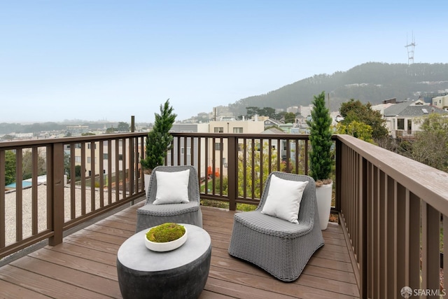 wooden terrace with a mountain view