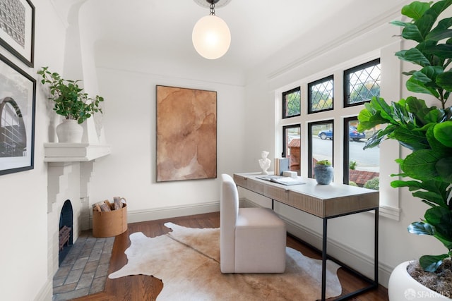 home office with dark wood-type flooring