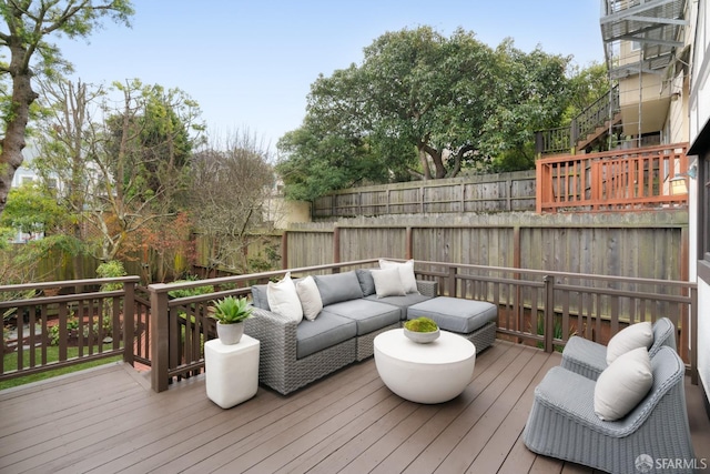 wooden deck featuring an outdoor hangout area