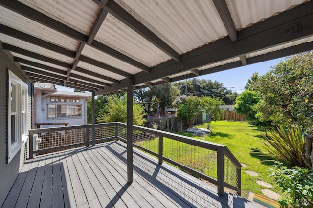 wooden terrace with a yard