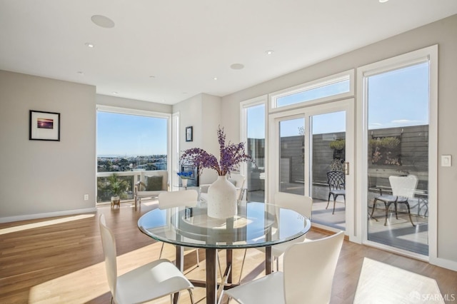 dining area with light wood-type flooring