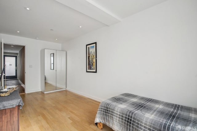 bedroom with light hardwood / wood-style floors