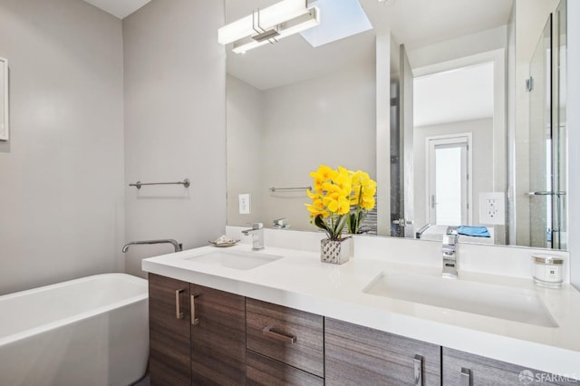 bathroom featuring vanity and a bath