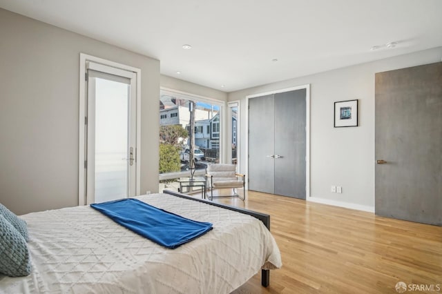 bedroom with light hardwood / wood-style flooring