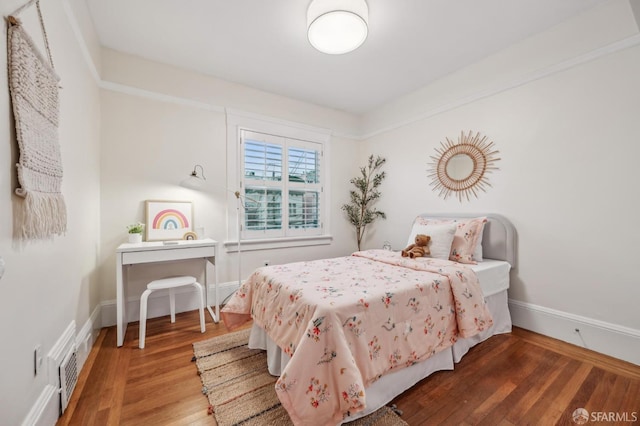 bedroom featuring wood-type flooring