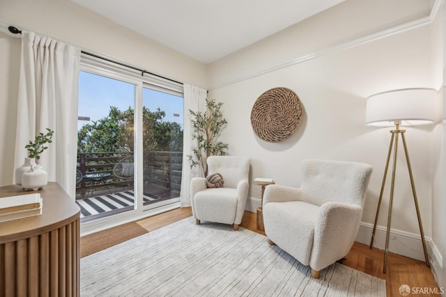 living area with hardwood / wood-style floors