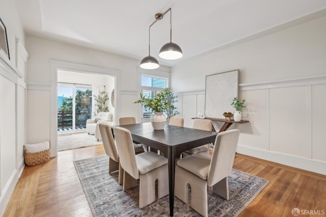 dining space featuring wood-type flooring