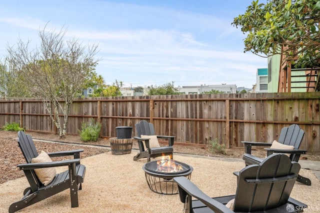 view of patio with an outdoor fire pit