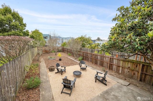 view of patio / terrace featuring an outdoor fire pit