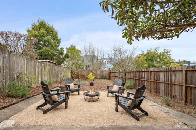 view of patio featuring an outdoor fire pit