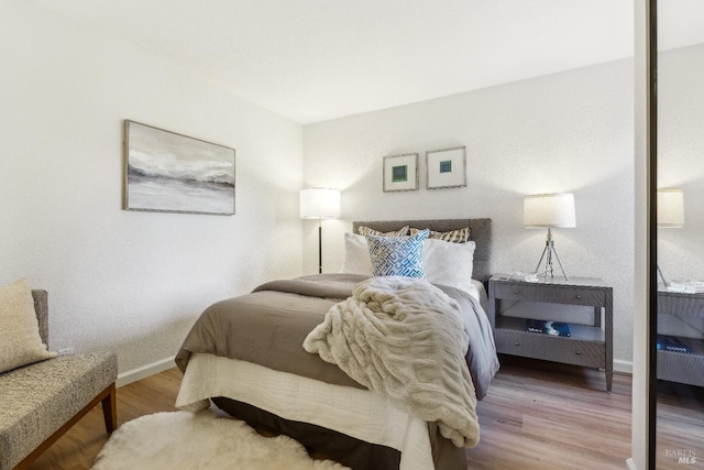 bedroom featuring hardwood / wood-style flooring