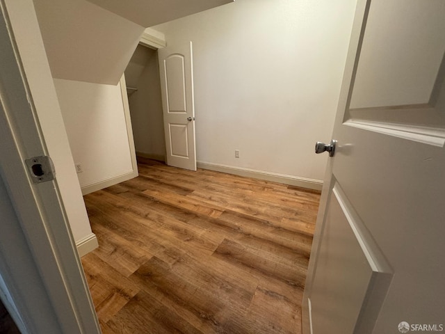 bonus room with light hardwood / wood-style floors