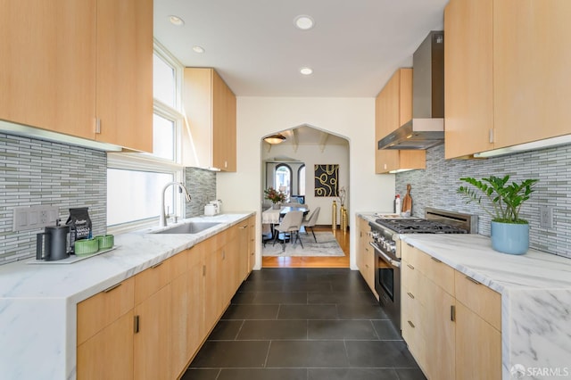 3544 Webster St, San Francisco, CA 94123 - kitchen featuring wall chimney exhaust hood, high end stainless steel range, light brown cabinets, healthy amount of natural light, and recessed lighting