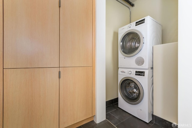 3544 Webster St, San Francisco, CA 94123 - washroom with estacked washer and dryer and dark tile patterned floors