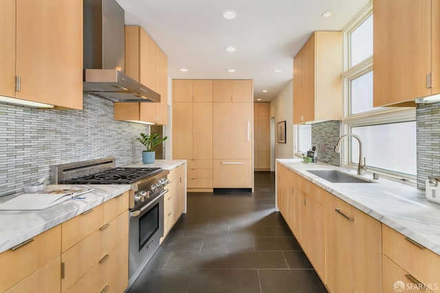 3544 Webster St, San Francisco, CA 94123 - kitchen with wall chimney exhaust hood, stainless steel range, light brown cabinetry, and recessed lighting
