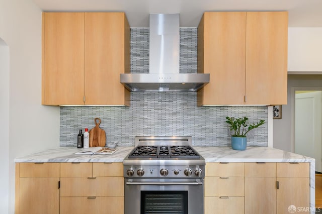 3544 Webster St, San Francisco, CA 94123 - kitchen featuring wall chimney range hood, high end stainless steel range oven, light brown cabinetry, and decorative backsplash