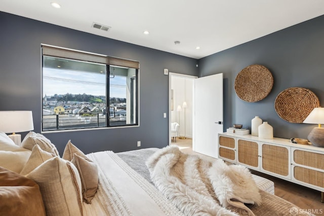 bedroom featuring wood-type flooring