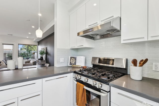 kitchen with pendant lighting, white cabinetry, tasteful backsplash, gas stove, and kitchen peninsula