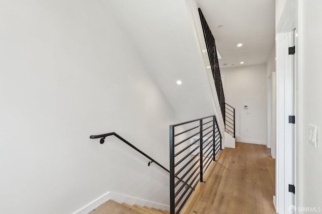 stairway with wood-type flooring