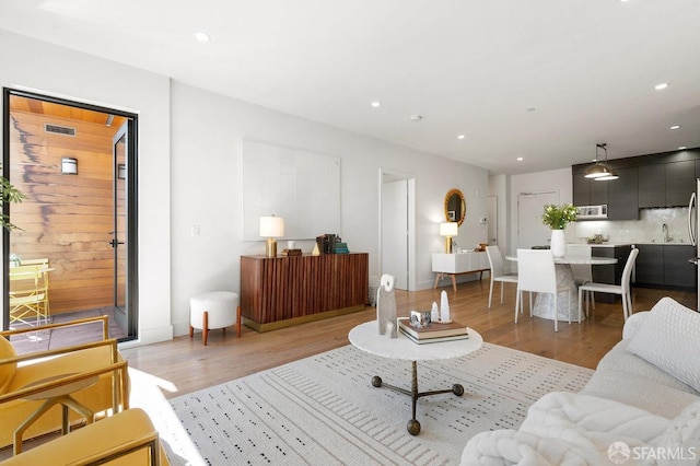 living room with light hardwood / wood-style floors