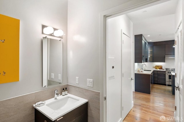 bathroom featuring vanity and hardwood / wood-style floors