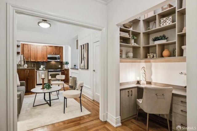 735 Geary St Unit 102, San Francisco, CA 94109 - office area with crown molding and light wood-style floors