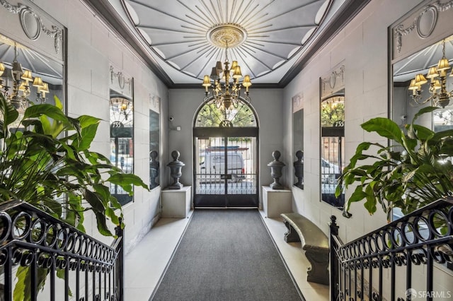 735 Geary St Unit 102, San Francisco, CA 94109 - entryway with a chandelier, crown molding, and concrete block wall