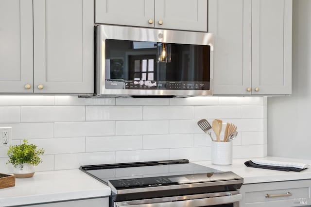 745 Redwood Rd, San Anselmo, CA 94960 - kitchen featuring appliances with stainless steel finishes, decorative backsplash, and light countertops