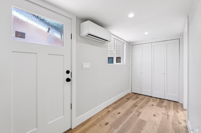 745 Redwood Rd, San Anselmo, CA 94960 - laundry area featuring a wall mounted AC, light wood finished floors, recessed lighting, and baseboards