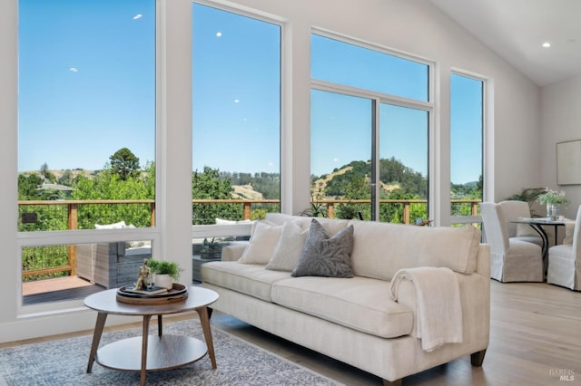 745 Redwood Rd, San Anselmo, CA 94960 - living room with healthy amount of natural light, wood finished floors, vaulted ceiling, and recessed lighting