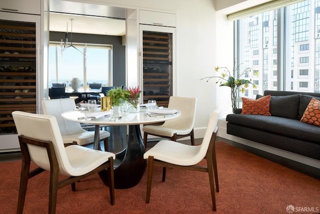 dining space featuring wine cooler and plenty of natural light