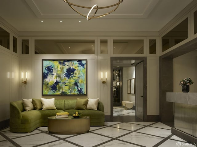 interior space featuring a tray ceiling and a chandelier