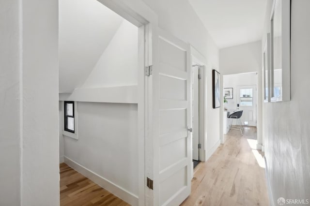 corridor with light wood-type flooring