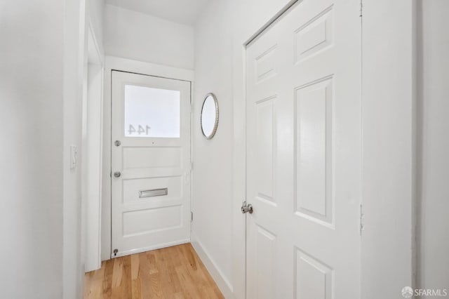 doorway to outside with light wood-type flooring