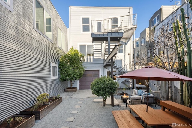 view of patio / terrace with a balcony and a garage