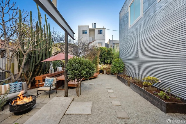 view of patio / terrace with an outdoor fire pit