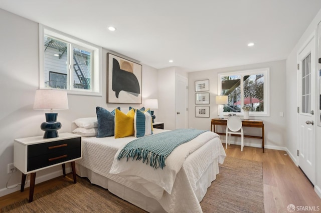 bedroom with hardwood / wood-style flooring