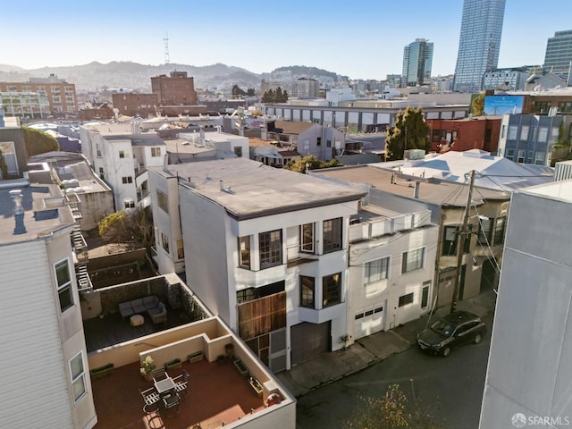 birds eye view of property with a mountain view