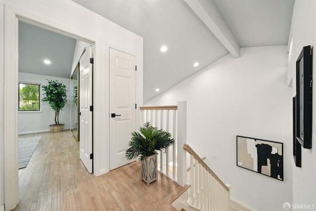 corridor with recessed lighting, vaulted ceiling with beams, light wood-type flooring, and an upstairs landing