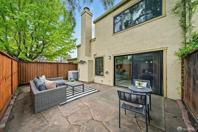 back of house with outdoor lounge area, central AC, a fenced backyard, stucco siding, and a patio area