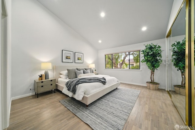bedroom featuring recessed lighting, baseboards, vaulted ceiling, and light wood-type flooring