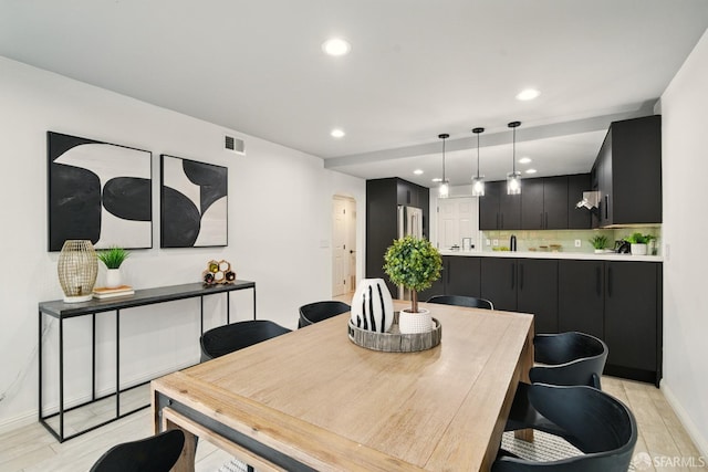 dining space with baseboards, recessed lighting, and visible vents