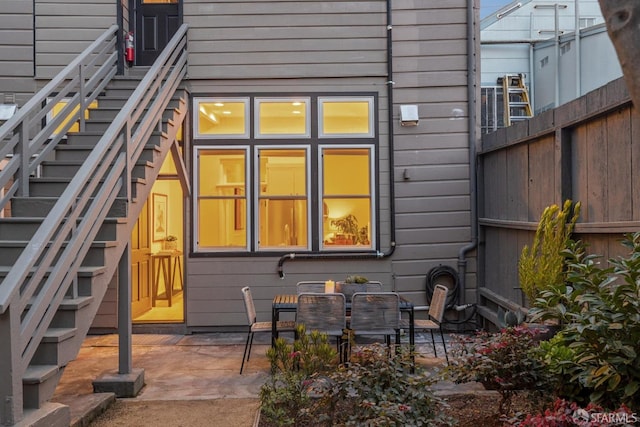 back of house featuring a patio area and fence