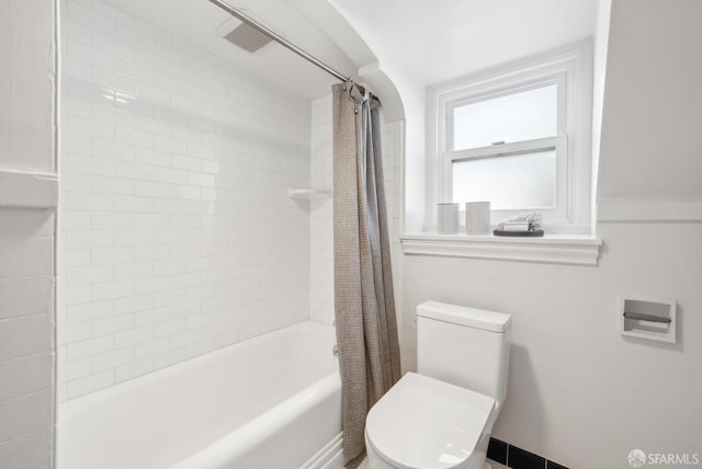 full bath with toilet and shower / tub combo with curtain